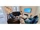 Comfortable living room with modern furnishings and bright natural light near the outdoor patio at 1201 Challenge Dr, Davenport, FL 33896