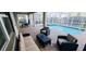Relax by the pool with comfortable seating and scenic views of the surrounding neighborhood at 1201 Challenge Dr, Davenport, FL 33896