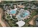 Aerial view of a community pool and recreation area with lush landscaping and palm trees at 1269 Long Cove Loop # 1269, Davenport, FL 33896