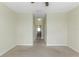 This is a carpeted bedroom with a view into the en-suite bathroom at 1269 Long Cove Loop # 1269, Davenport, FL 33896