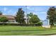 Well-manicured lawn featuring a sign for the Oasis Clubhouse at 1269 Long Cove Loop # 1269, Davenport, FL 33896