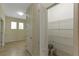 Hallway area leading to storage and spare rooms featuring neutral walls and tile flooring at 1269 Long Cove Loop # 1269, Davenport, FL 33896