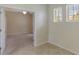 Office room featuring neutral walls, carpet, tile flooring, and natural light from two windows at 1269 Long Cove Loop # 1269, Davenport, FL 33896