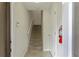 Bright entryway featuring staircase with carpeted steps and white walls at 1269 Long Cove Loop # 1269, Davenport, FL 33896