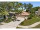 Aerial shot of home featuring mature trees, a driveway, and attached garage at 1346 Palo Alto Ct, Winter Springs, FL 32708