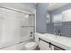 Bathroom with shower and tub combination, modern vanity, and stylish tile accents at 1346 Palo Alto Ct, Winter Springs, FL 32708