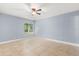 Cozy bedroom with tile flooring, neutral walls, and ample natural light from the large window at 1346 Palo Alto Ct, Winter Springs, FL 32708
