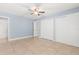 Spacious bedroom with tiled floors, two large closets, and access to an ensuite bathroom at 1346 Palo Alto Ct, Winter Springs, FL 32708