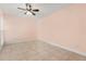 Bright bedroom with tiled floors, neutral walls, and a ceiling fan at 1346 Palo Alto Ct, Winter Springs, FL 32708
