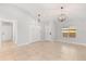 Open concept living space with tile flooring, updated light fixtures, and neutral paint colors at 1346 Palo Alto Ct, Winter Springs, FL 32708