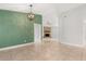 Inviting living area with tiled floors leading to a stone fireplace and bright interior at 1346 Palo Alto Ct, Winter Springs, FL 32708
