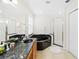Elegant bathroom with double sinks, a soaking tub, and a glass-enclosed shower at 1400 Holly Glen Run, Apopka, FL 32703
