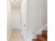 Well-lit hallway with tile flooring and access to multiple rooms at 1400 Holly Glen Run, Apopka, FL 32703