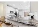 Bright kitchen with granite counters, subway tile backsplash, and stainless steel appliances at 1400 Holly Glen Run, Apopka, FL 32703