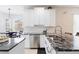 Modern kitchen featuring granite countertops, stainless steel appliances, and ample cabinet space at 1400 Holly Glen Run, Apopka, FL 32703