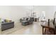 Bright living area with neutral colors, tile flooring, and a comfortable seating arrangement at 1400 Holly Glen Run, Apopka, FL 32703