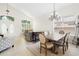 Open-concept living and dining area with vaulted ceilings and plenty of natural light at 1400 Holly Glen Run, Apopka, FL 32703