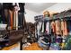 Spacious walk-in closet with built-in shelving and plenty of storage space for shoes and clothing at 1400 Holly Glen Run, Apopka, FL 32703