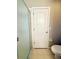 Toilet and partial shower view with glass doors at 14715 Buckingham Gate Ct, Orlando, FL 32828