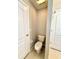 Half bath with tile flooring and white fixtures at 14715 Buckingham Gate Ct, Orlando, FL 32828