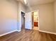 Bedroom featuring doorways to other rooms and gorgeous flooring at 14715 Buckingham Gate Ct, Orlando, FL 32828