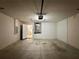 Spacious and functional empty garage with door to interior at 14715 Buckingham Gate Ct, Orlando, FL 32828
