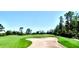 Panoramic view of a pristine community golf course with manicured green and sand trap at 14715 Buckingham Gate Ct, Orlando, FL 32828