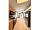 Kitchen area features tile floors, stainless steel appliances, a skylight, and access to the living area at 14715 Buckingham Gate Ct, Orlando, FL 32828