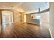 Bright open-concept living room with wood floors and natural light at 14715 Buckingham Gate Ct, Orlando, FL 32828