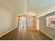 Bright open-concept living room with wood floors and natural light at 14715 Buckingham Gate Ct, Orlando, FL 32828