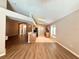 Open living space with hardwood floors and views into the kitchen area with natural light at 14715 Buckingham Gate Ct, Orlando, FL 32828