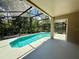Screened pool area looks out to nature at 14715 Buckingham Gate Ct, Orlando, FL 32828