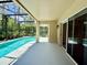 Inviting screened-in pool area with sliding glass doors and ample patio space for outdoor lounging and entertaining at 14715 Buckingham Gate Ct, Orlando, FL 32828