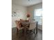 Charming dining area featuring a rustic wood table, perfect for Gathering meals at 1635 Wynford Cir, Tavares, FL 32778
