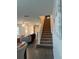 Welcoming entryway with a view of the staircase, connecting the living spaces at 1635 Wynford Cir, Tavares, FL 32778