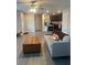 Cozy living room featuring stylish furniture, seamlessly connecting to the kitchen area at 1635 Wynford Cir, Tavares, FL 32778