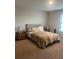 Serene main bedroom featuring neutral tones and a comfortable bed, creating a relaxing retreat at 1635 Wynford Cir, Tavares, FL 32778