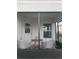 Screened-in patio with seating offers an inviting space for relaxation, complemented by views of the backyard at 1635 Wynford Cir, Tavares, FL 32778