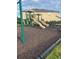 Community playground offers a slide and play area for children, set against a building backdrop at 1635 Wynford Cir, Tavares, FL 32778
