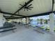 Covered picnic tables with a scenic lake view provide a great place to relax at 164 Royal Palm Dr, Leesburg, FL 34748