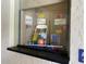 Clear case filled with fitness items and motivational signage at 164 Royal Palm Dr, Leesburg, FL 34748
