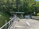 Community dock on the water surrounded by mature trees offers a peaceful retreat for residents at 164 Royal Palm Dr, Leesburg, FL 34748