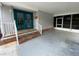 Inviting entrance featuring double doors and white railing at 164 Royal Palm Dr, Leesburg, FL 34748