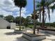 The community features landscaped grounds with palm trees and shrubbery in decorative planters at 164 Royal Palm Dr, Leesburg, FL 34748
