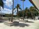 The community features beautifully landscaped grounds with palm trees in decorative planters at 164 Royal Palm Dr, Leesburg, FL 34748
