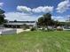 An overview of the community with well-maintained lawns and emergency services present at 164 Royal Palm Dr, Leesburg, FL 34748