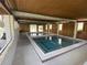 Relax in one of two indoor hot tubs with privacy screens and wood ceiling at 164 Royal Palm Dr, Leesburg, FL 34748