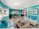 Cozy living room with neutral decor, wicker furniture, and stylish accents at 164 Royal Palm Dr, Leesburg, FL 34748