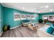 Bright and airy living room featuring stylish wicker furniture, complemented by modern flooring and paint at 164 Royal Palm Dr, Leesburg, FL 34748
