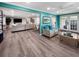 Open-concept living space with seamless flow to dining and living areas, perfect for modern living at 164 Royal Palm Dr, Leesburg, FL 34748